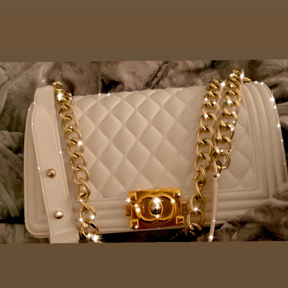 This is a white luxury chain purse, cute and goes with literally everything
